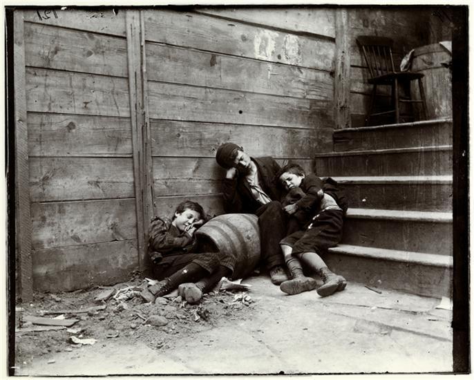Street Arabs night, Boys in Sleeping Quarter, Jacob Riis, 1890. From the collection of Museum of the City of New York, 90.13.1.124. Describe what you see in this photograph.