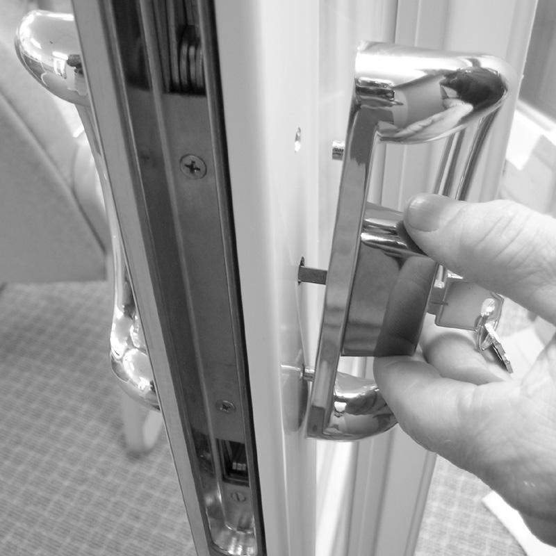 The interior handle has a thumb latch to operate the locking mechanism. 2. Assemble latch shim, thumb latch and interior handle as shown ().