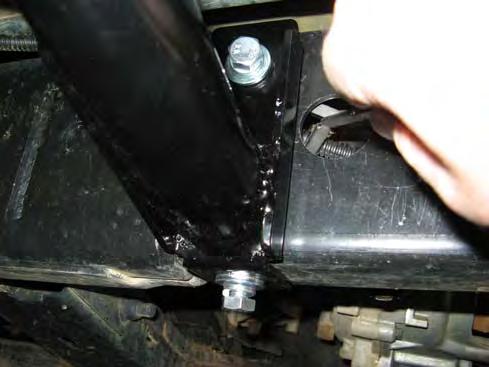 30. Using an 11mm drill bit, drill through the bottom of the chassis, using the hole in the bottom of the centre bracket as a guide.