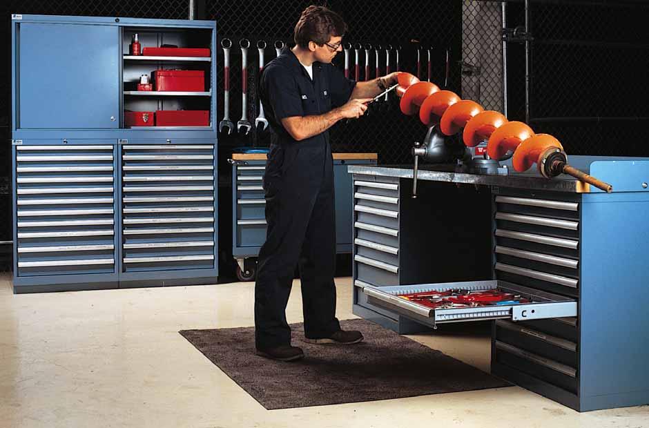 Heavy-duty Lista industrial workbenches combine with Lista stacked cabinets to create an organized, efficient