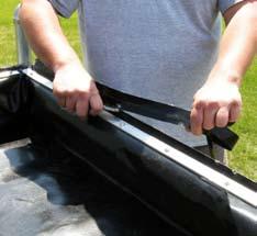 Repeat the steps to attach the remaining sides of the bed liner using the Tek screws and aluminum strap.