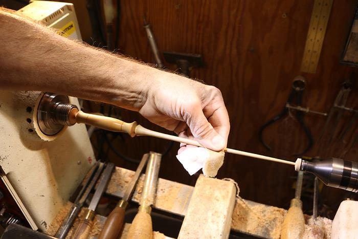 I like to use beeswax to finish cedar wands, applied with the lathe running and melted into