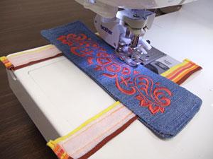 Turn the wrap right side out. Press the seams with an iron and fold the fabric of the opening in 1/2 inch and press.