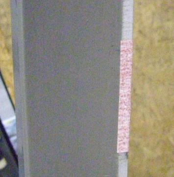 Place the sandpaper on the edge of the trim section, just beside the paint line (1/4" (6.5mm) from the side) with the surplus on the back side.