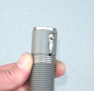 A #8 screw with washer can then be inserted through the terminal end and attached to the other hole in the aluminum end cap through the coil form side.