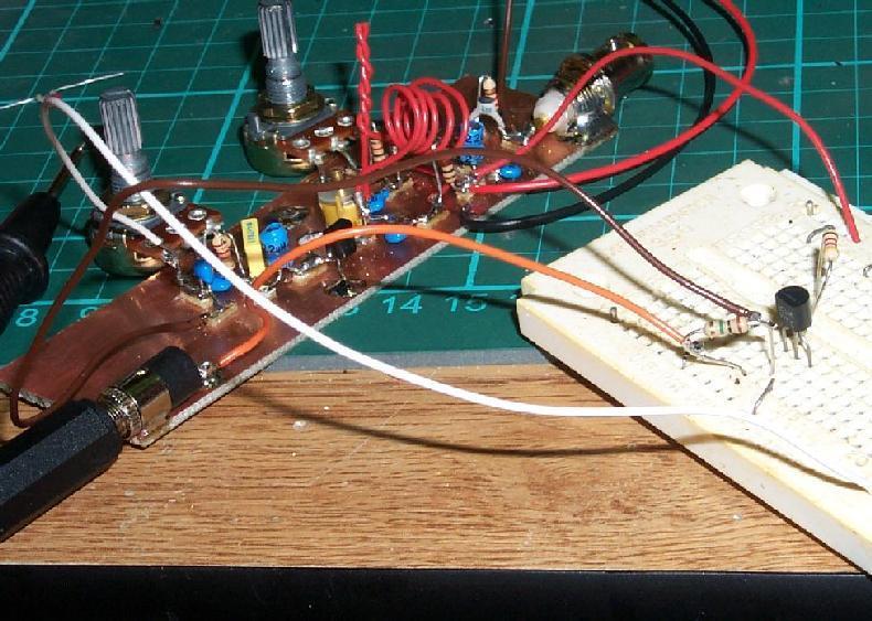 Here is an image of much earlier in the construction, the audio stages were built last (unusual), the audio pre-amp is on the breadboard, tacked to the rest of the circuit by some hook-up wire.