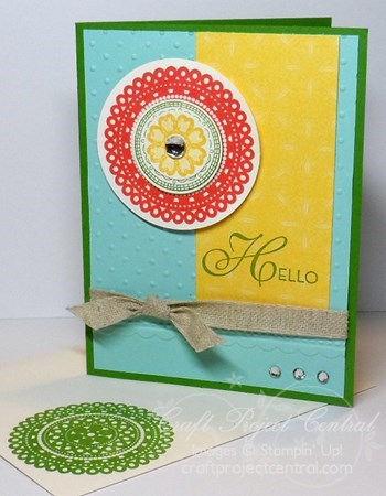 Attach the circles to the top left of the card with four Stampin Dimensionals. Attach a rhinestone from the Large Rhinestones Basic Jewels pack to the center of the flower circle.