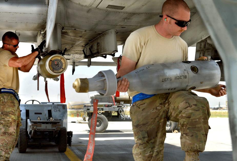 submunition, which used acoustic sensors on its wings to detect and target tanks. Air Force weapons load-crew chiefs load precisionguided munitions on an A-10C in Afghanistan in 2013.