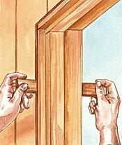 Use pairs of tapered shims to plumb and level the door frame in