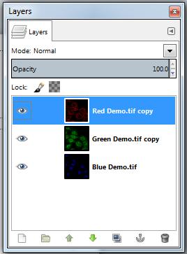 Click and drag image layer in to the working window of another