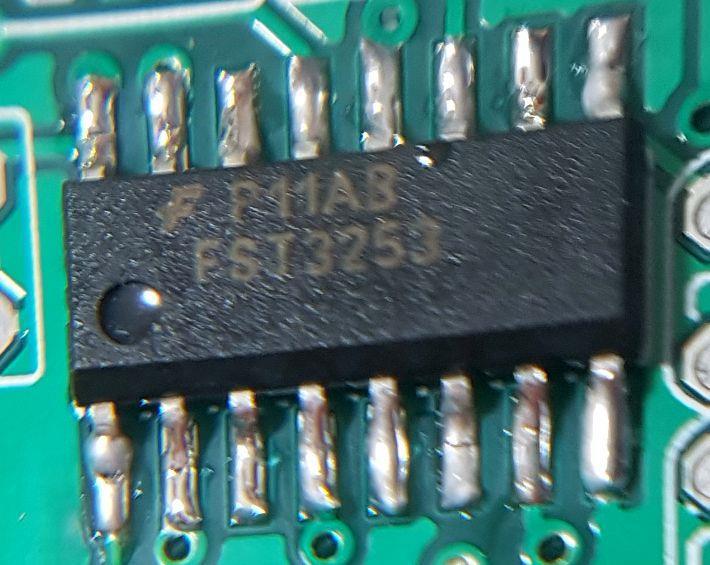 You can check the alignment of each pin against its PCB pad using a jeweller s loupe or magnifying glass. (below left). First solder two pins at diagonal opposites on the IC (above right).
