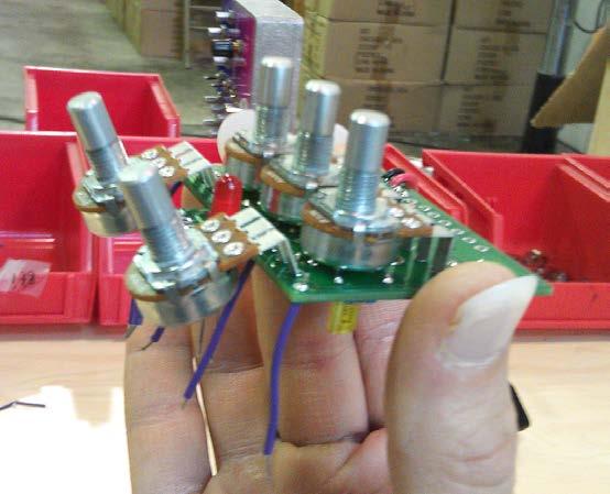 Step 3: Hold the PCB in one hand so that the component side of the PCB is in the palm of your hand and the bottom side with the pots and LED is facing up.