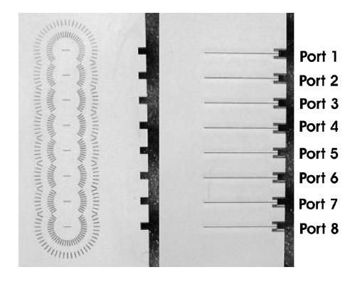 Fig. 9 1-D scanning array composed of 8 elements with PCS-EBGs (front and back view). The active s-parameters of the array prototype have been measured showing a 15% bandwidth [6].