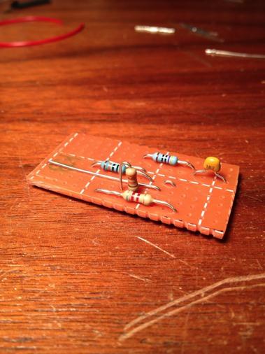 Solder a 0.01µf capacitor between rows N and Q in column F.