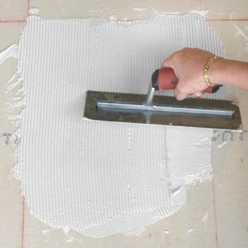 Step 5: Spread the Thin Set Evenly spread the thin set using the notched side of your trowel.