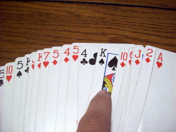 { Free Card Trick No. 1 ] 2. Ask an audience member to select a random card from the deck.