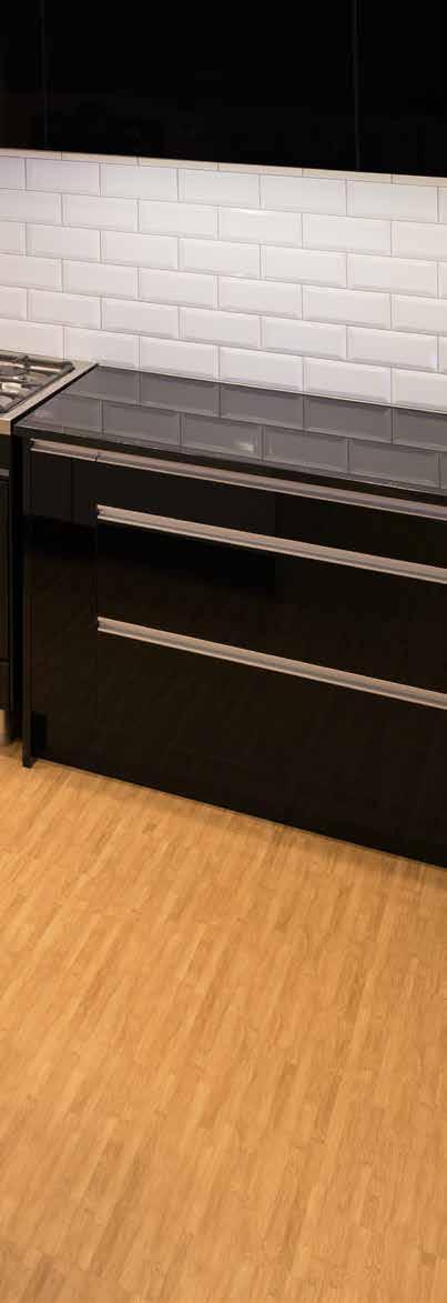 DESIGNER LINE KITCHEN WITH ISLAND CABINET COLOUR Acrylic Phantom Black BENCHTOP COLOUR Caesarstone Raw Concrete Cabinetry pre-assembled Ready for installation 8,710 PRICE INCLUDES Cabinets, doors &