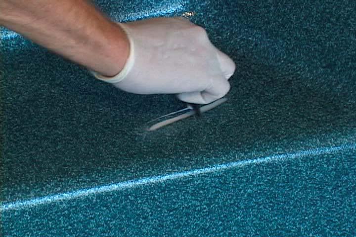 grinder. Use a slow speed to prevent excessive heat buildup. Continue until the surface is flat and even with the spa surface. 10) Sand slightly with 100 grit wet or dry sandpaper.