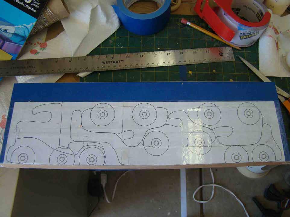 the pattern from the sawn wood toy with clear packing tape. An important reason to use board.