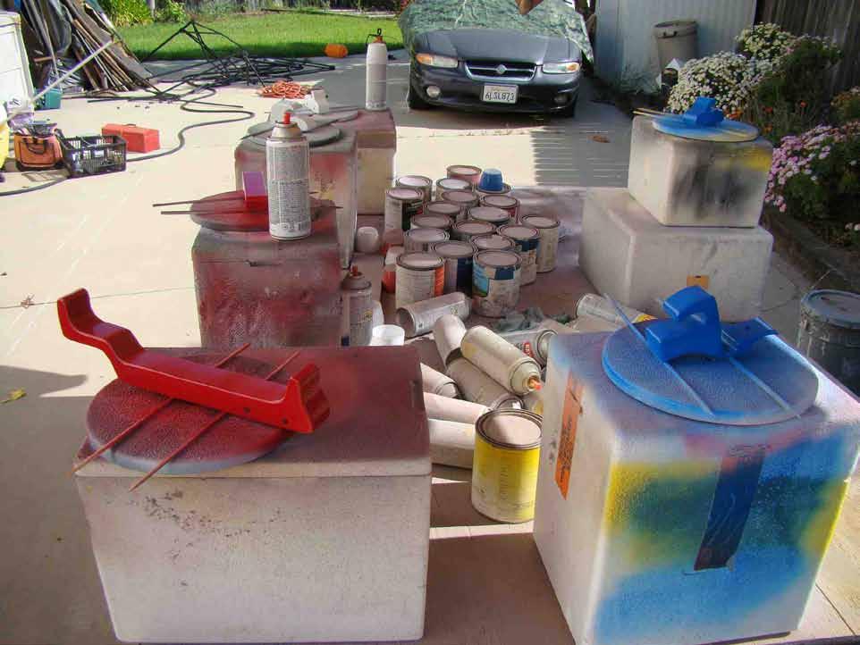 large pieces of scrap for other paint station with wheel support dowels sharpened paint my first build of the car carrier with red, white small projects.