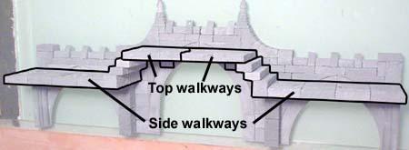 Trim apart the upper walkway. Each half will go on each side of the bridge.