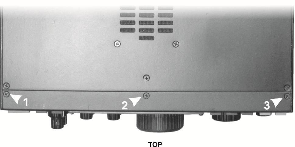Remove the three screws on the top lip of the front panel (see Figure 5) Figure 5.