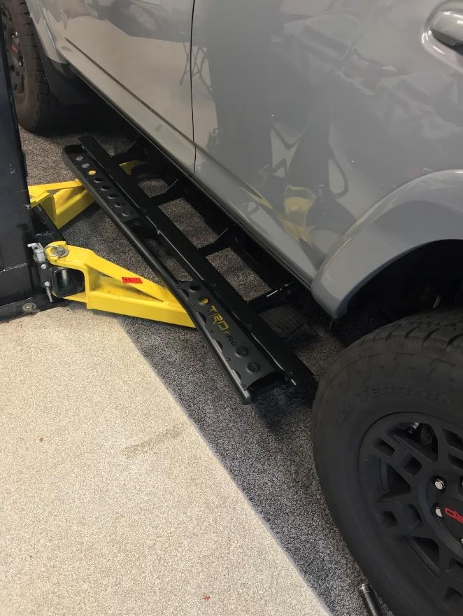 Install: 1) With the help of a floor jack or buddies, lift the rock slider up into position on the frame rail, making sure that the e-brake cable mounting bracket does not get caught between the