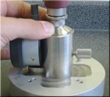 7. Turn the mechanical micrometer until there is a gap between the fixture