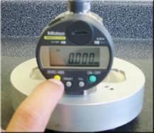 Depress the ZERO button on the digital micrometer and establish the zero point