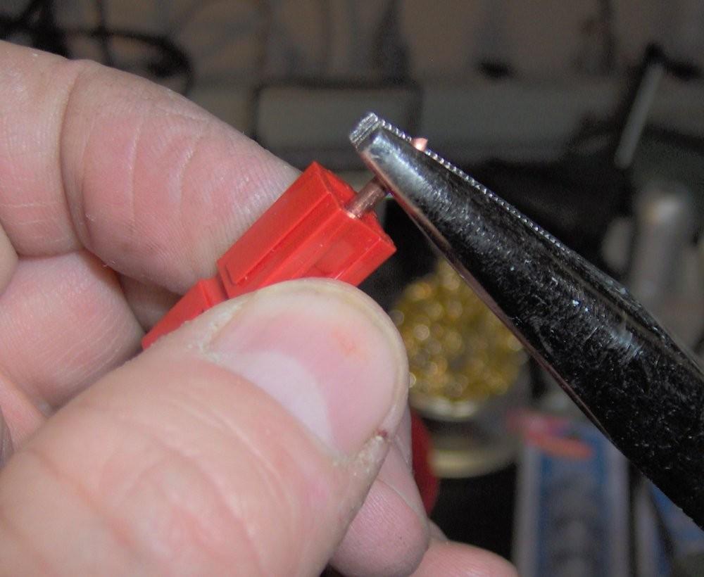 Use some needle nose pliers and firmly push the contact into the connector shell.