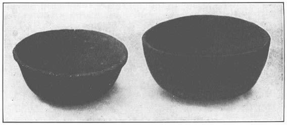 dots or other small figures in relief. A group of these rim shards is shown in figure 162.