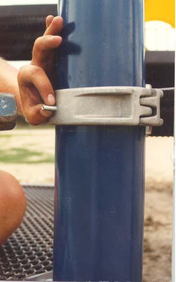When all (4) posts are plumb and stable, drill through the deck clamps and into the posts with a ¼ metal drill bit.