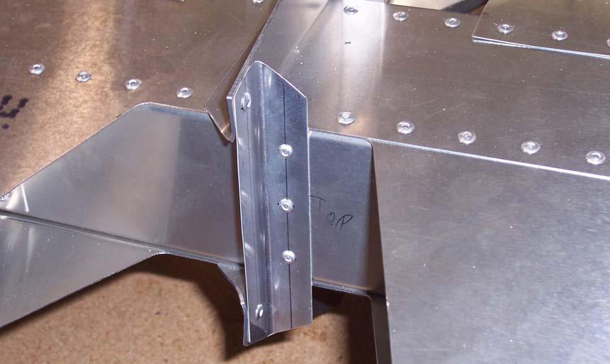 Mark a rivet centered on the L Angle and one rivet 26mm above and below the center rivet. Center the L Angle on the Rear Channel and clamp the L Angle to the Upper and Lower Horns.