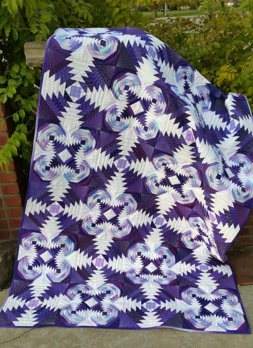 A Tarted Up Pineapple Quilt Size: 48 x 84 Finished by Janna L Thomas Block Size: (12) 12 x 12 large Pineapple block and (12) 12 x 12 (four patch consisting of 4 small 6 x 6 Pineapple blocks) Tool
