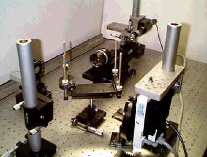 The beamsplitter then redirects approximately half of the light to fixed mirror and the other half to the moving mirror.