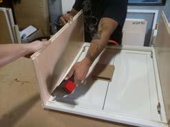 Use provided plastic assembly blocks and staple them to the face frame/side panel to secure in place Use the