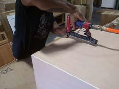 Using either the provided assembly blocks/ metal brackets or a brad nail gun,
