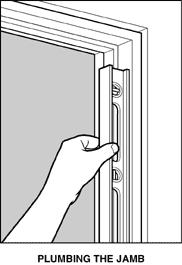 Slide the new door unit into the rough opening bottom end first and tilt it into place. Position the door unit in the rough opening so the edges of the jambs are flush with the wallboard.