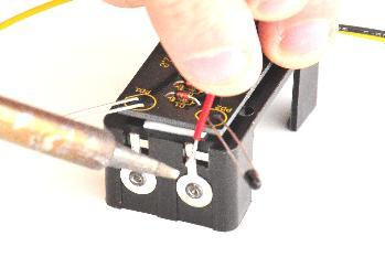 As shown above, place the last two pieces of heatshrink on