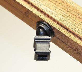 Purchase (shorter) replacement screws if the screw is long enough to protrude through the top surface of the handrail.