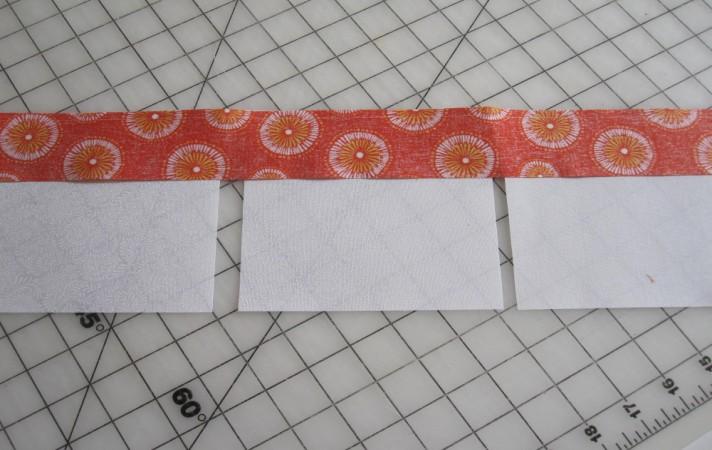 Referring to the fabric labels on page 2, add 2 strip C to the right and left sides of the squares using Patchwork Foot