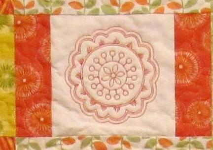 Embroidered Quilt Designs Mark the center of all the 5 white squares with a removable marking pen. (photo 11) Hoop all layers of the quilt.