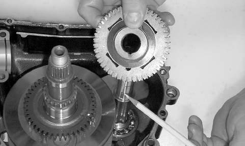 NOTE: There is a flat spot on the crank balancer to allow clearance past the crankshaft. Fig. 3-661 6. Using a rubber mallet, tap on the crankcase to remove the driveshaft. Fig. 3-658 CC678 9.