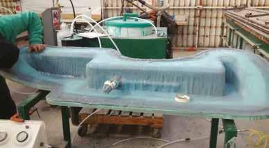 Vacuum is used both to form the composite material and to draw in the resin that impregnates it.