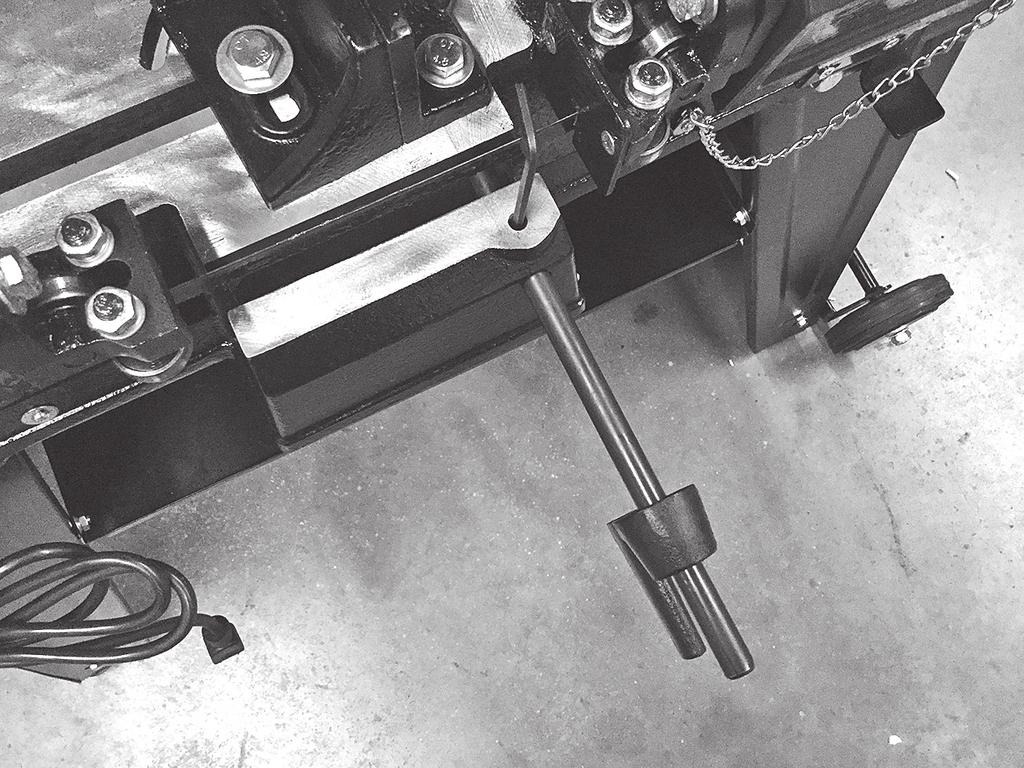 Slide work stop into place and tighten set screw (FIG. 5). 6. Before operating Bandsaw, it is recommended to square the vise and table bed to the blade.