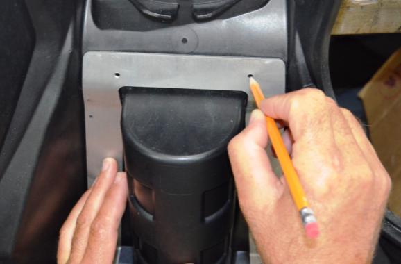 Use the supplied M4 flat head bolts to properly locate the decal to the drilled holes