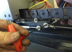 Next, attach the loop on the end of the cord to the bolt on the very rear end of the chuck trolley.