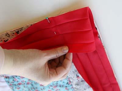 Then, fold the tape down and continue to pin and sew along the remaining sides.
