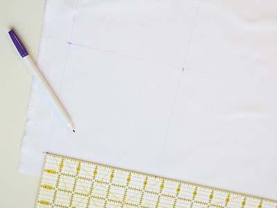 Using an air-erase pen, draw a 6 1/2" x 6 1/2" square on the fabric meant for the embroidered blocks.