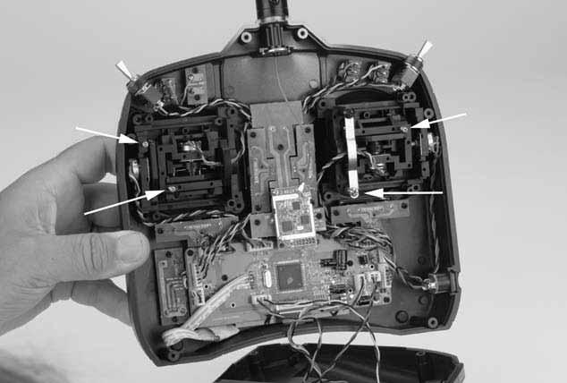 Remove the transmitter back, being careful not to cause damage to any components.